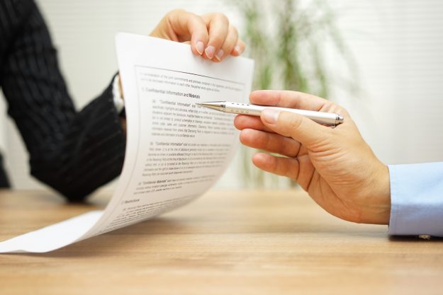 businesswoman holding legal document and wants an explaination about article